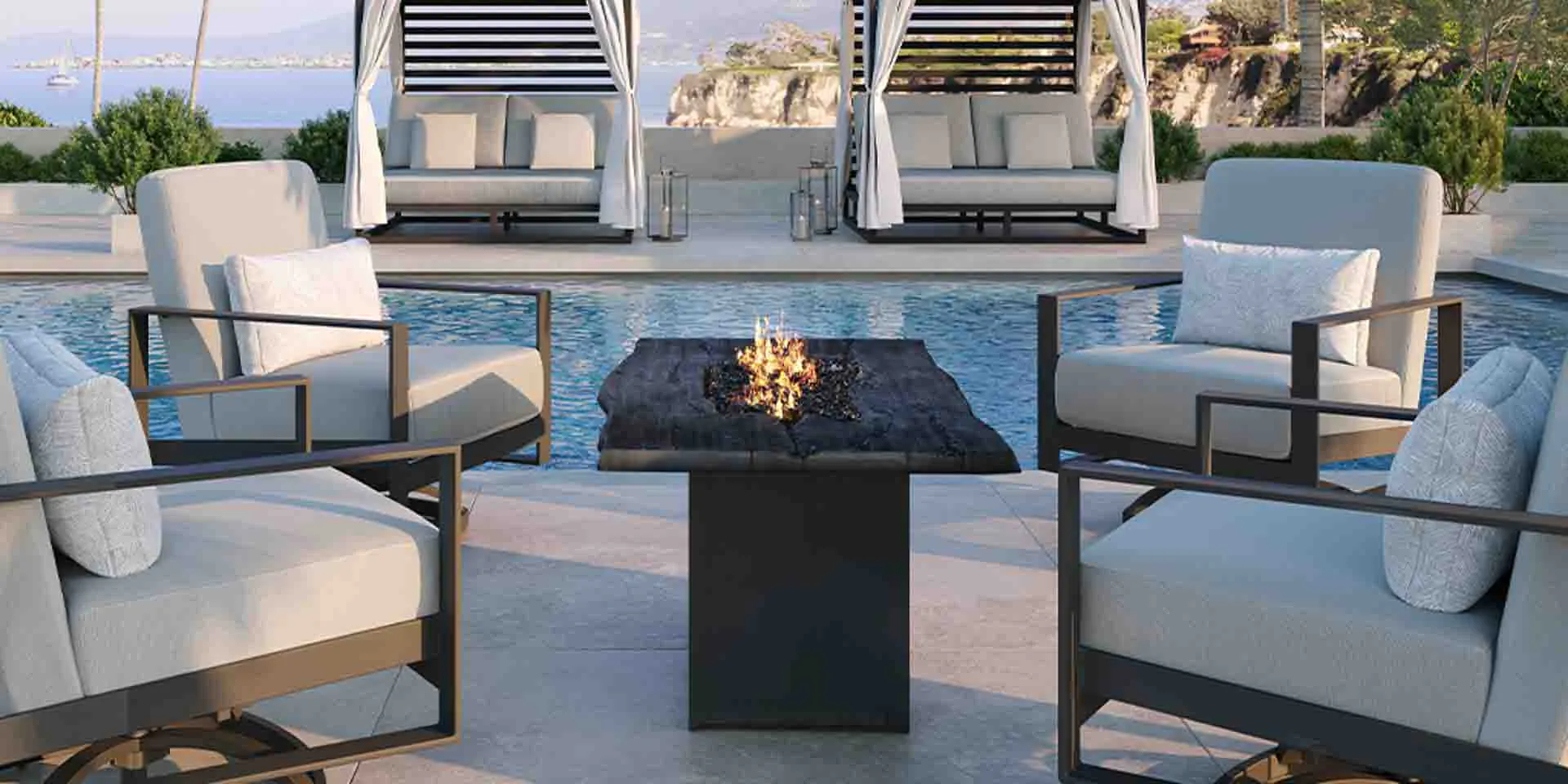 Outdoor contemporary poolside ensemble with lounge chairs, fire table, and cabanas.