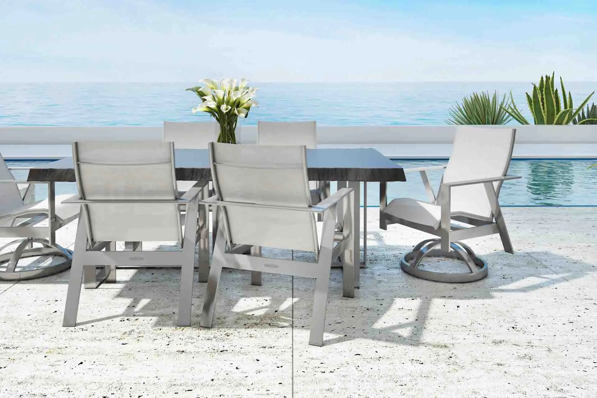Poolside dining chairs and table in outdoor ensemble.