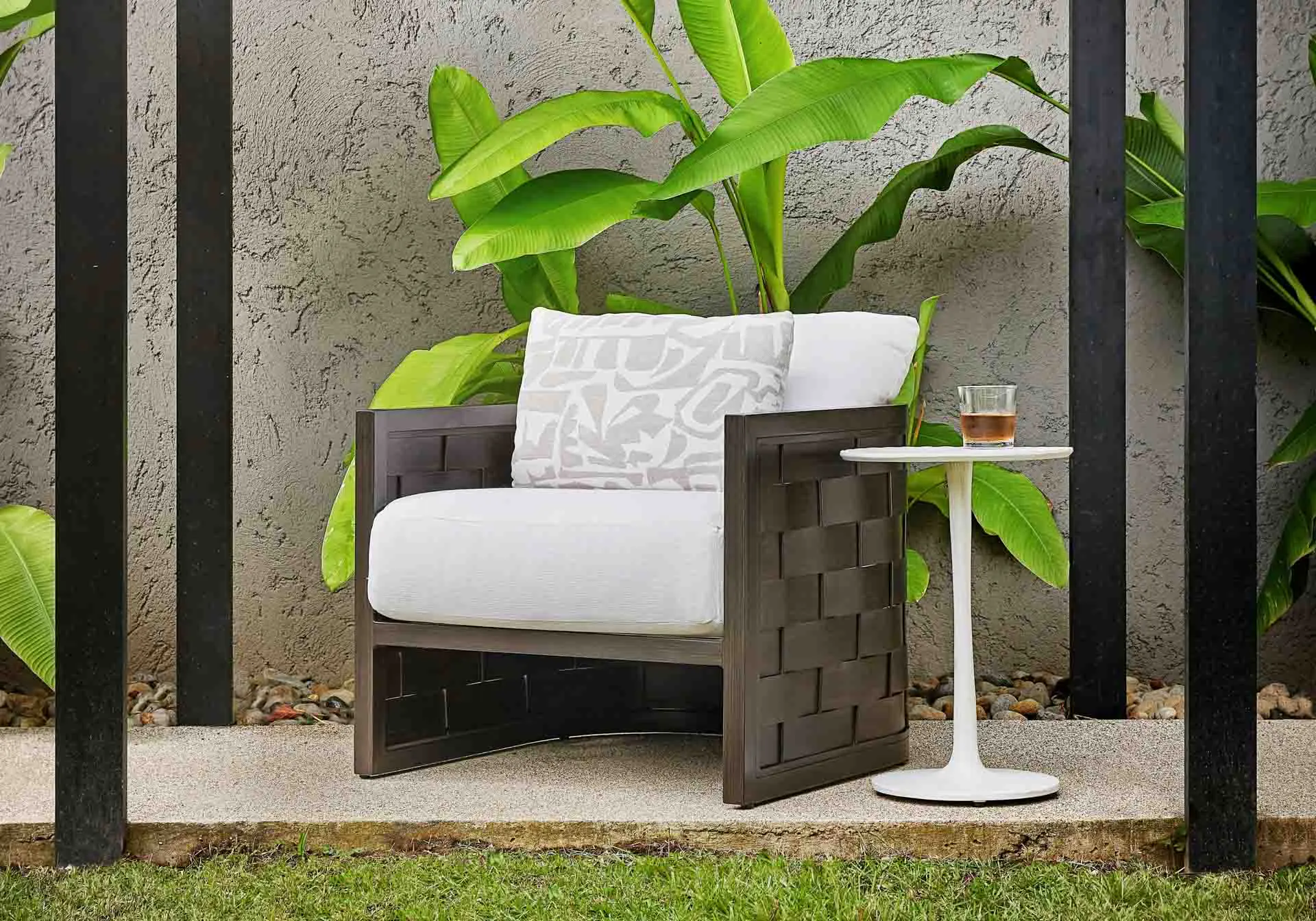 Outdoor lounge chair in patio setting.