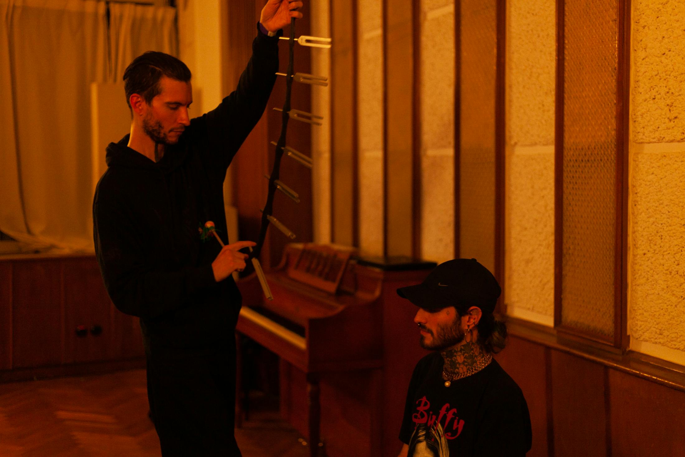 Ground Tactics and Nina Pixel's sound hypnotic installation. Artist ground tactics performs the immersive installation using tuning forks on a participant 