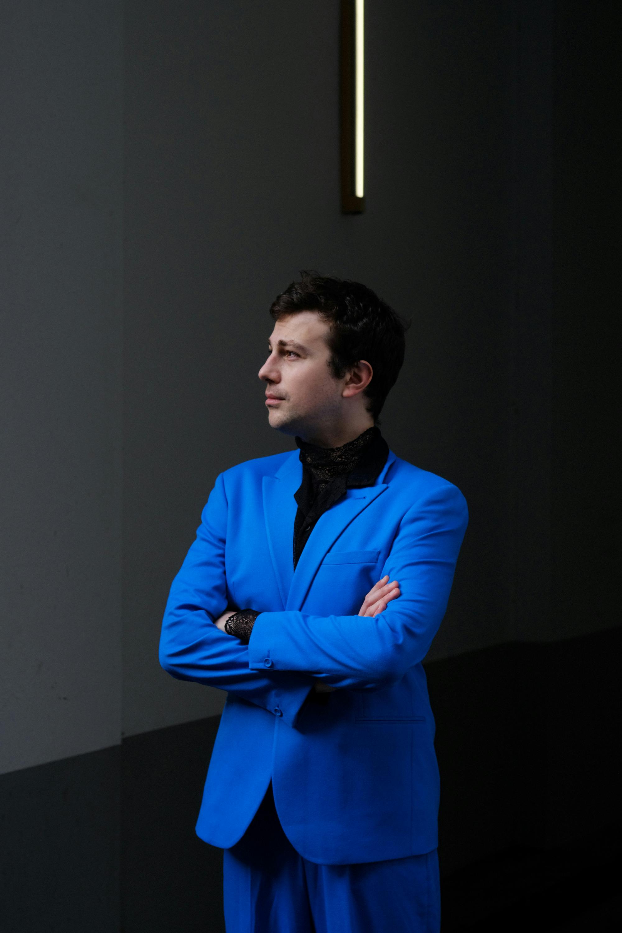 Catalyst tutor Uroš Pajović wearing a bright blue suit.