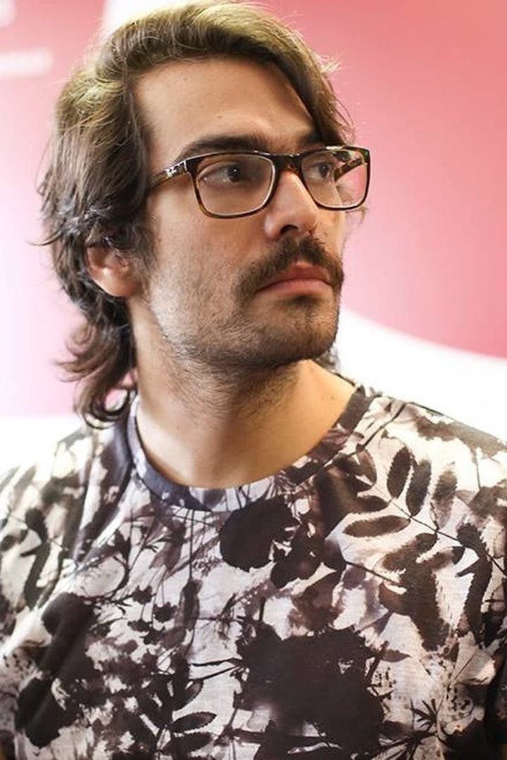 Film director Gustavo Vinagre looks to the left