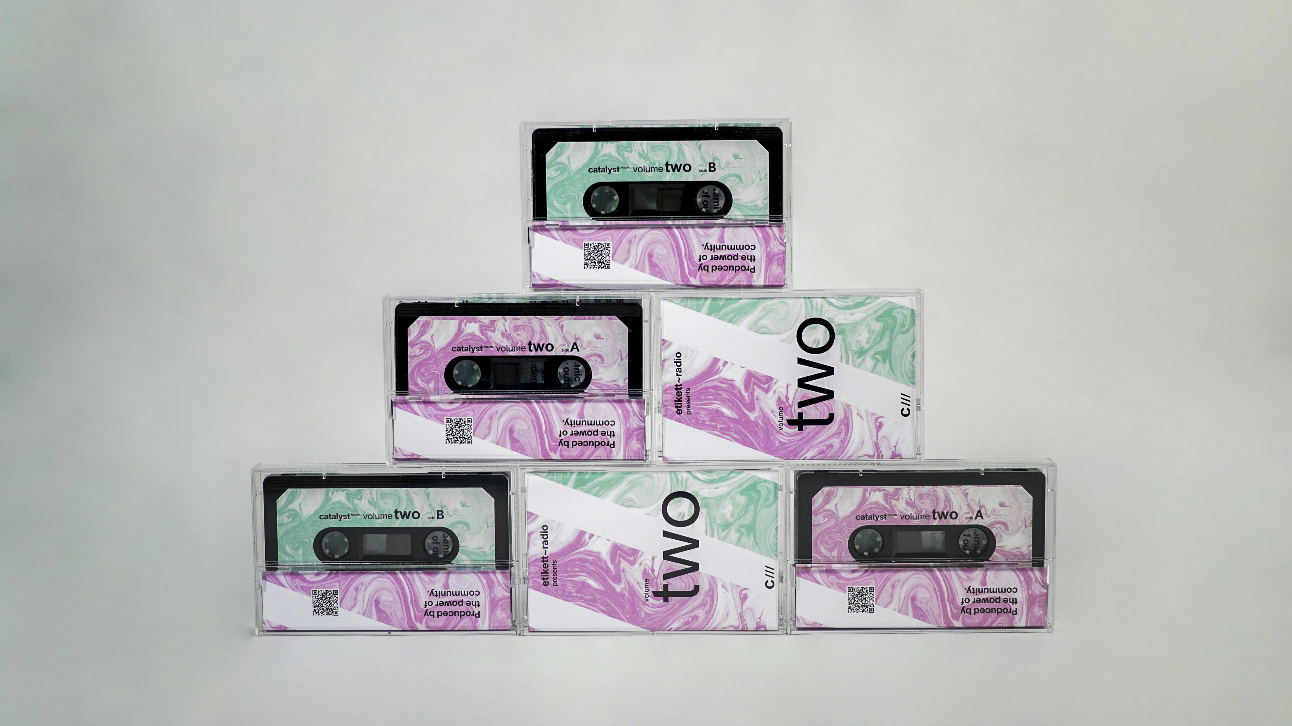 A stack of copies of catalyst music volume TWO cassette