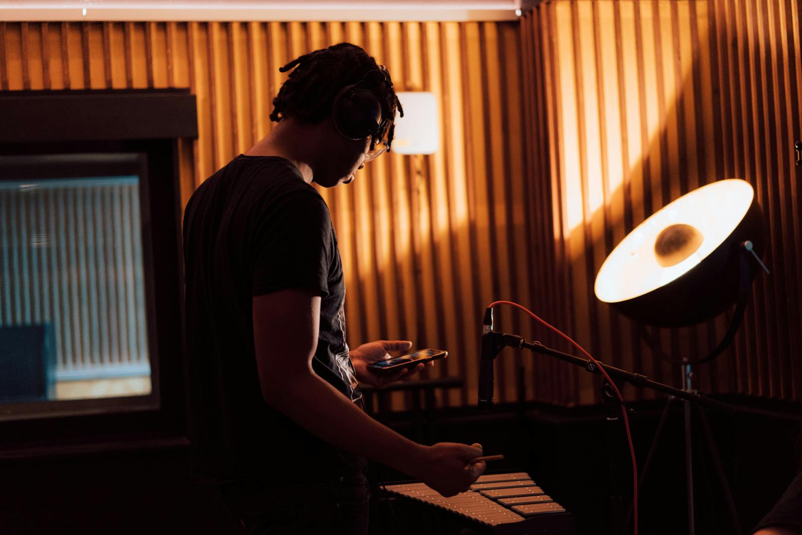 Students recording xylophone in Audio Production course during music summer school short courses at Catalyst in Funkhaus. 