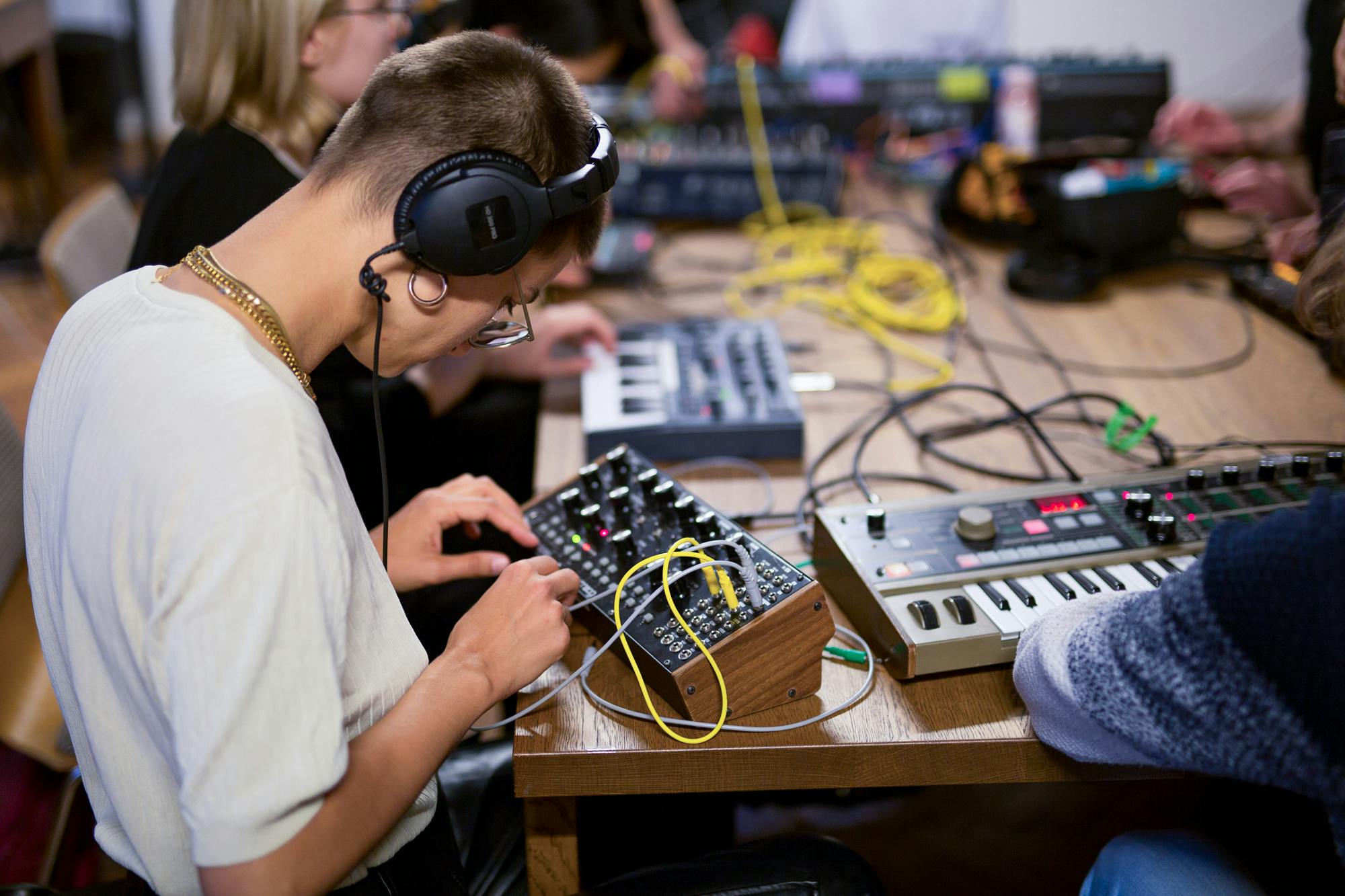 students in focus using various electronic instruments