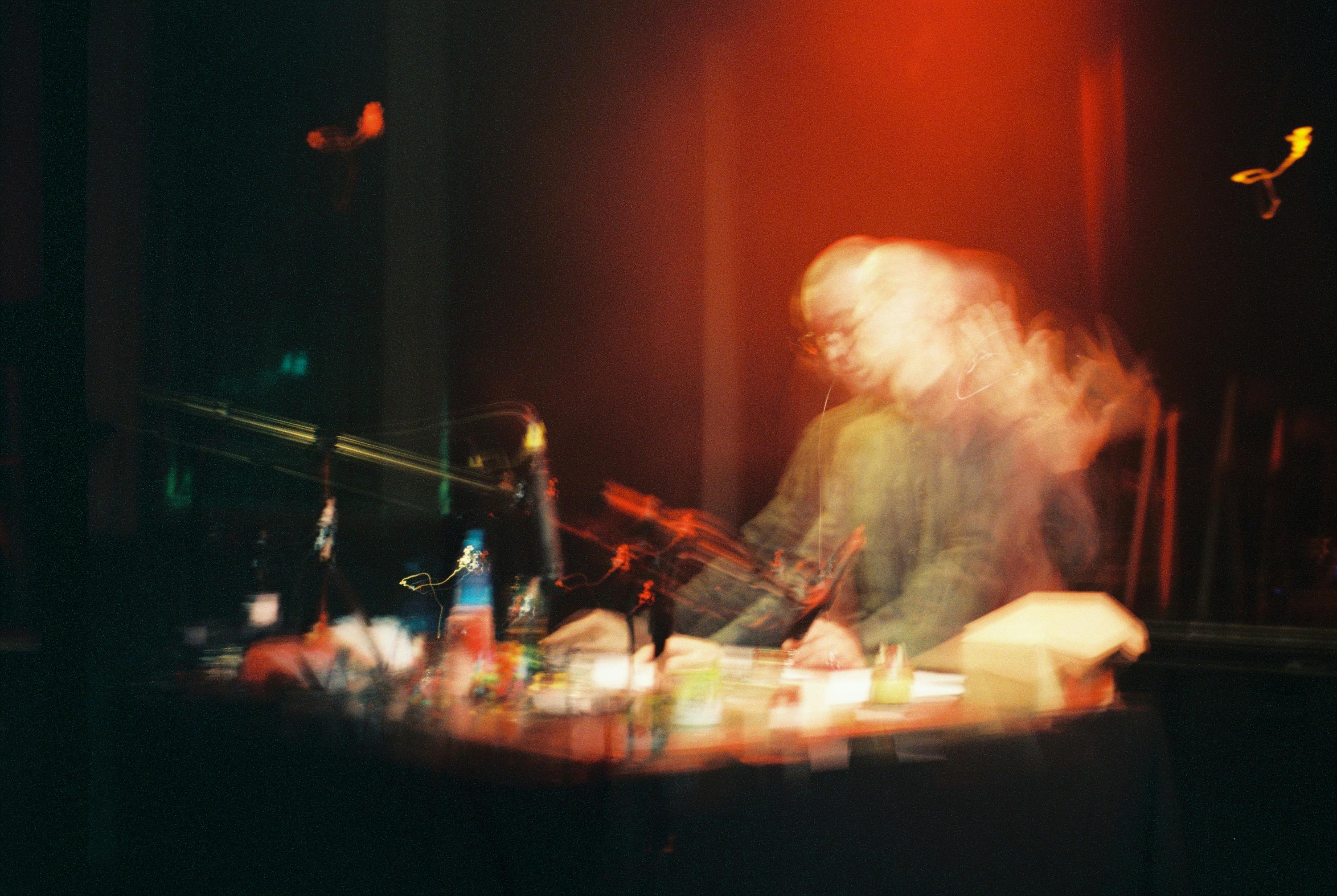 blurred image of Gabriel Lemos performing
