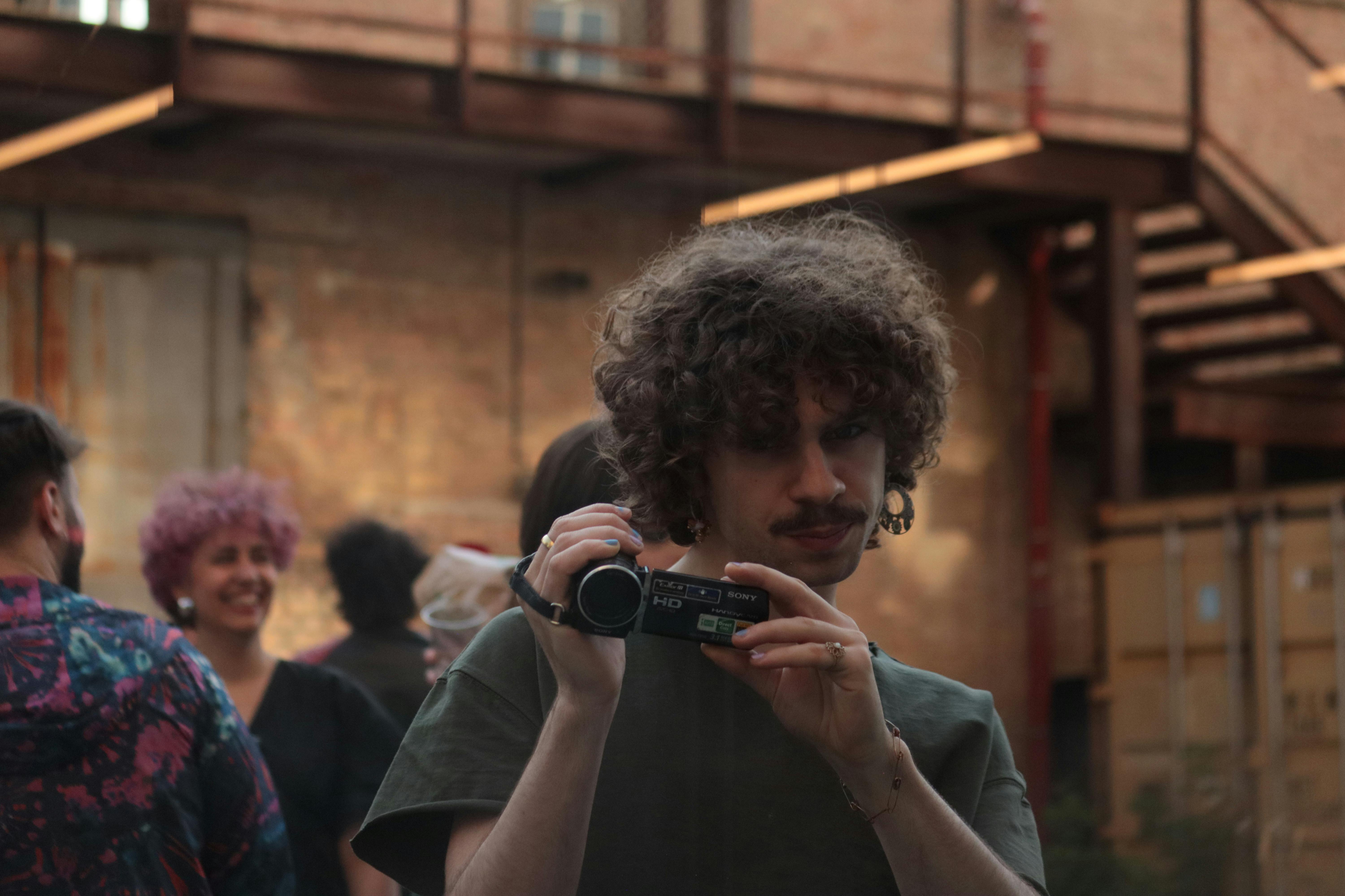 Catalyst student filming the event with a camera