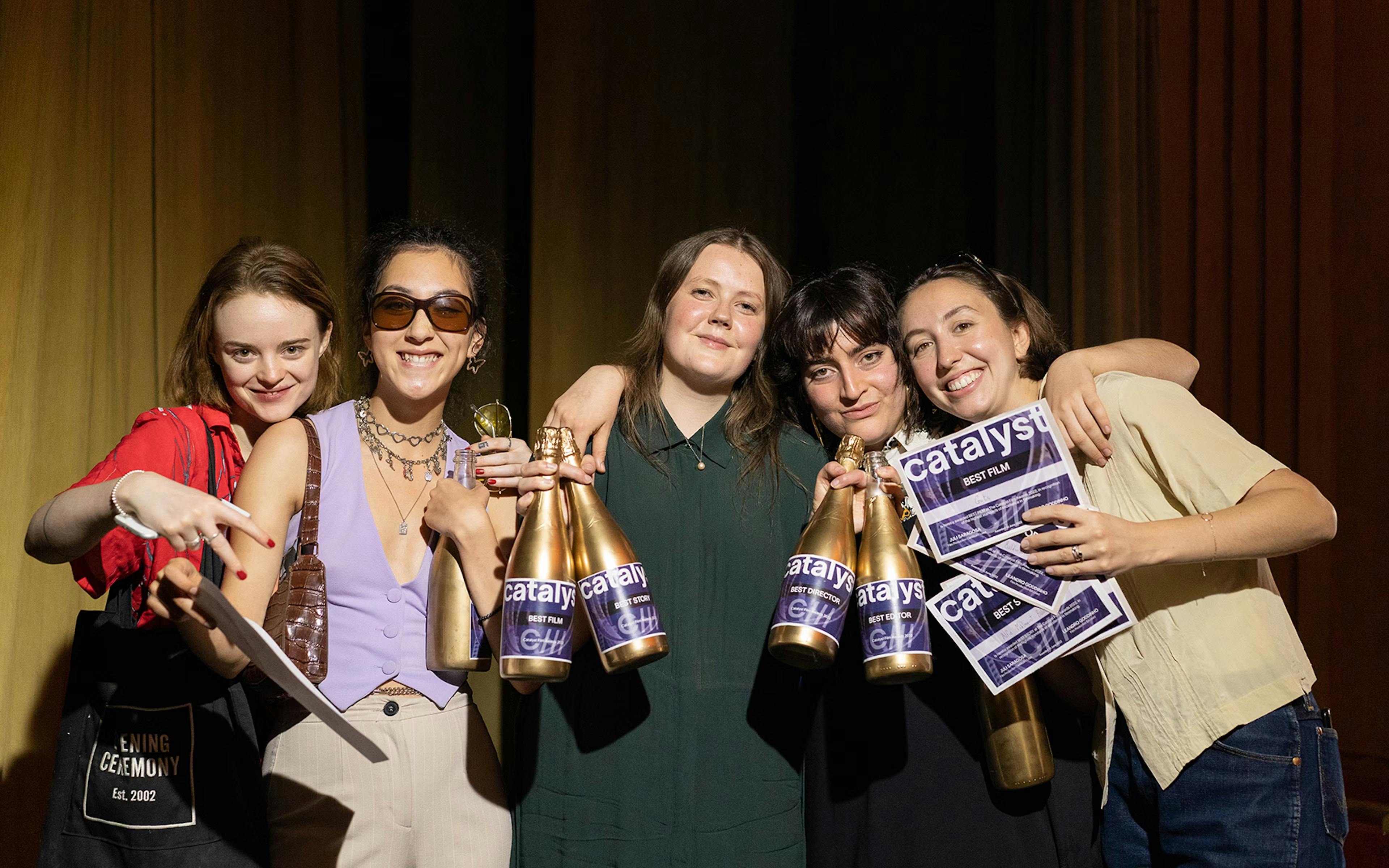 Group of students smiling with awards