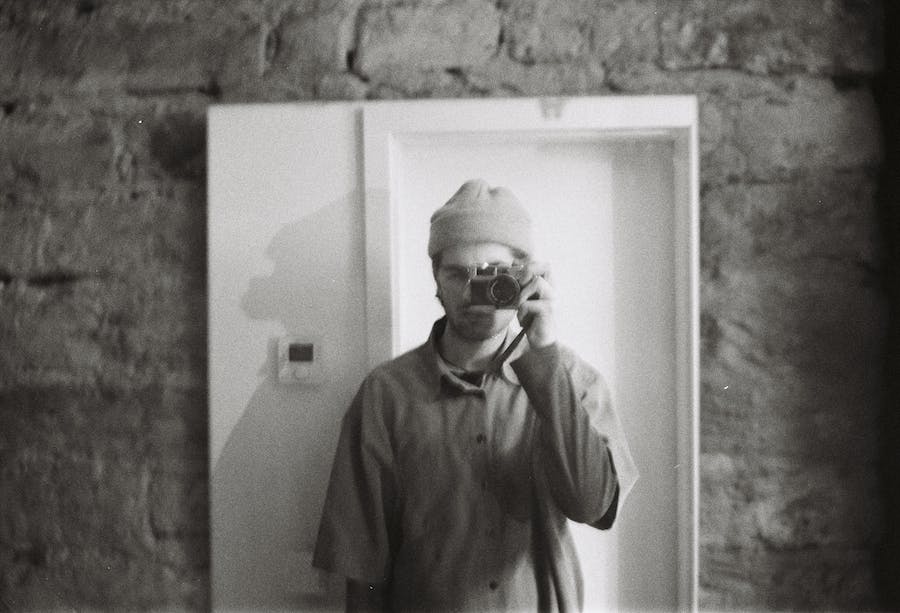 film technician ergi dosti uses his film camera