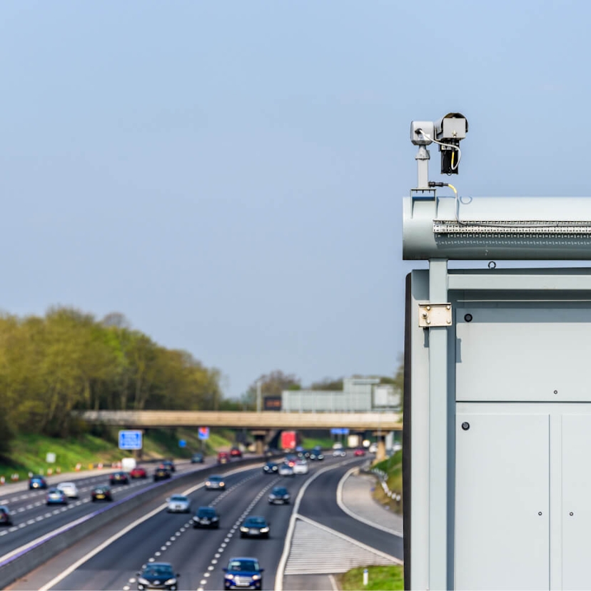 View of busy UK motorway with ANPR camera