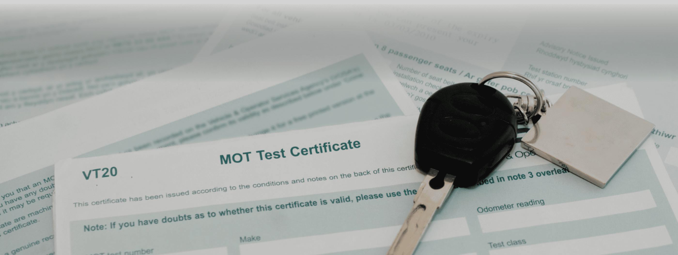 Top of an MOT test certificate with car keys