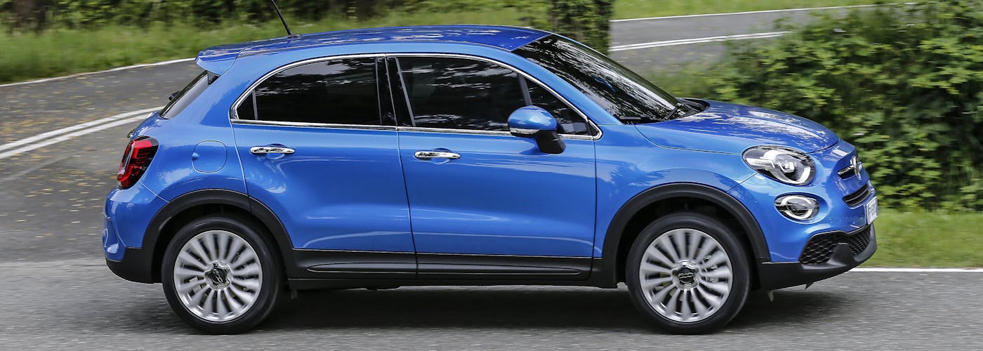 The side exterior of a blue Fiat 500X