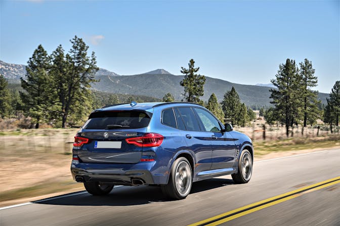 The rear exterior of a blue BMW X3