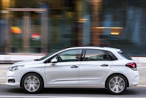 The side exterior of a white Citroen C4