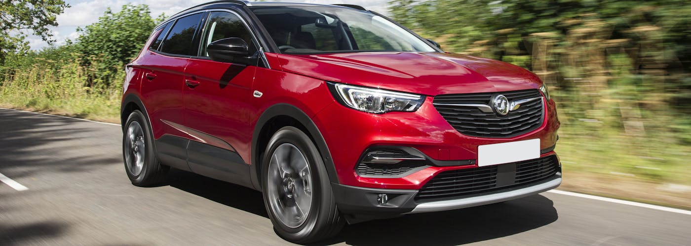 The front exterior of a red Vauxhall Grandland X