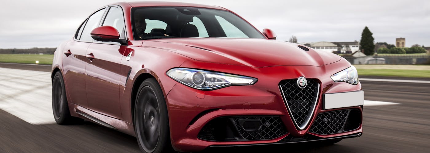 The front exterior of a red Alfa Romeo Giulia