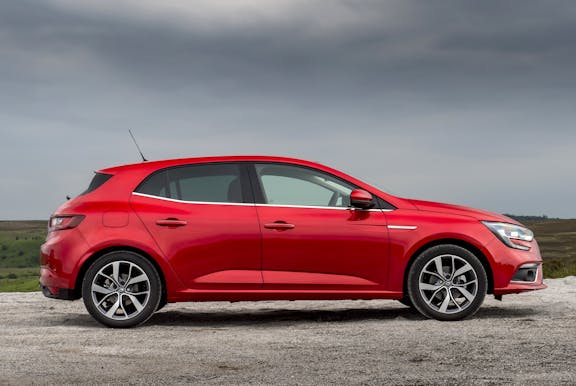 The side exterior of a red Renault Megane
