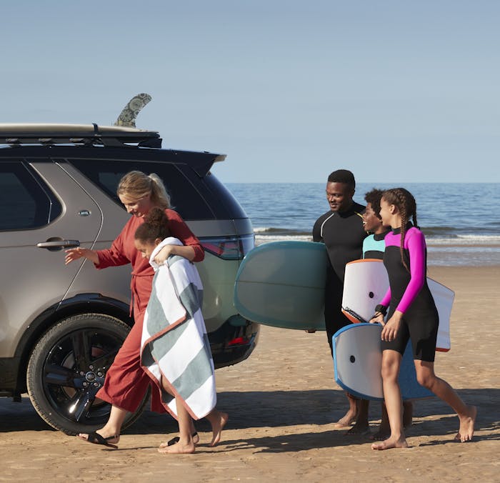 Land Rover Discovery with family