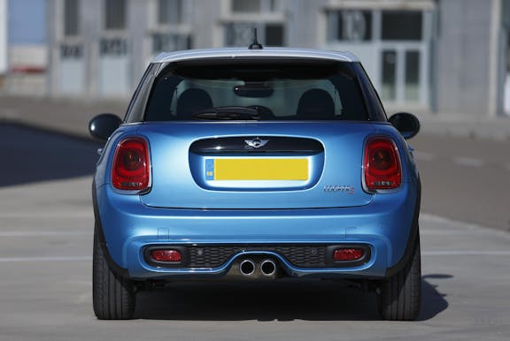 The rear exterior of a blue Mini Hatch