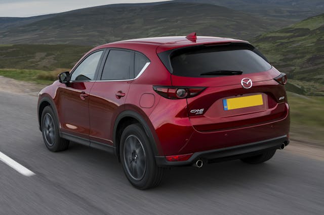 The rear exterior of a red Mazda CX-5