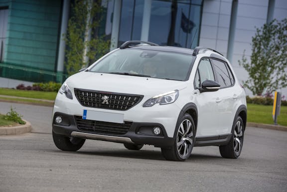 The front exterior of a white Peugeot 2008