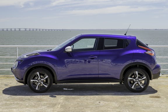 The side exterior of a blue Nissan Juke