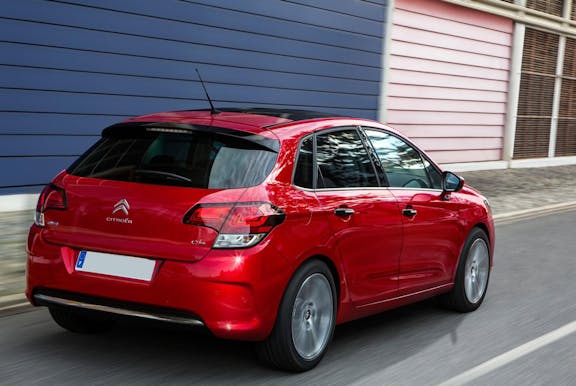 The rear exterior of a red Citroen C4