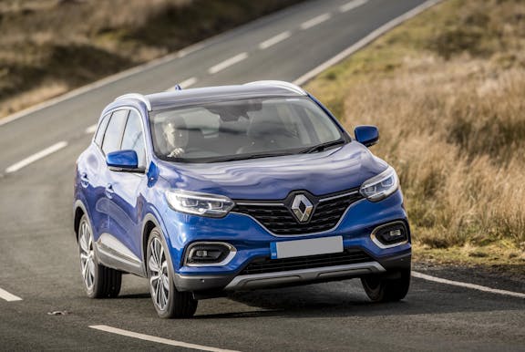 The front exterior of a blue Renault Kadjar