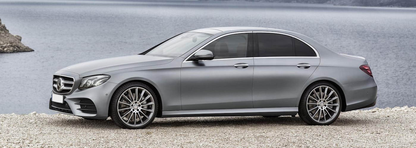 The side exterior of a silver Mercedes-Benz E-Class