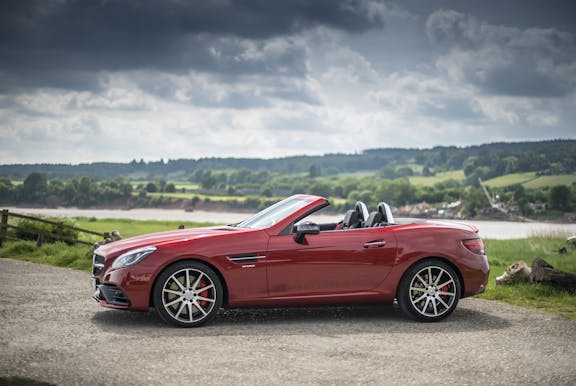 The side exterior of a red Mercedes-Benz SLC
