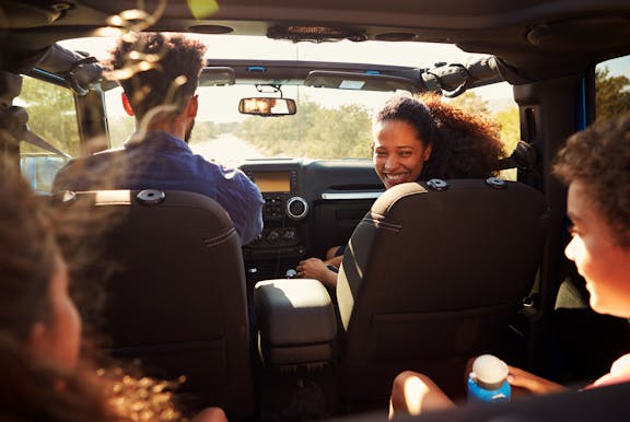 Family driving a car