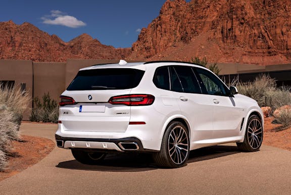 The rear exterior of a white BMW X5