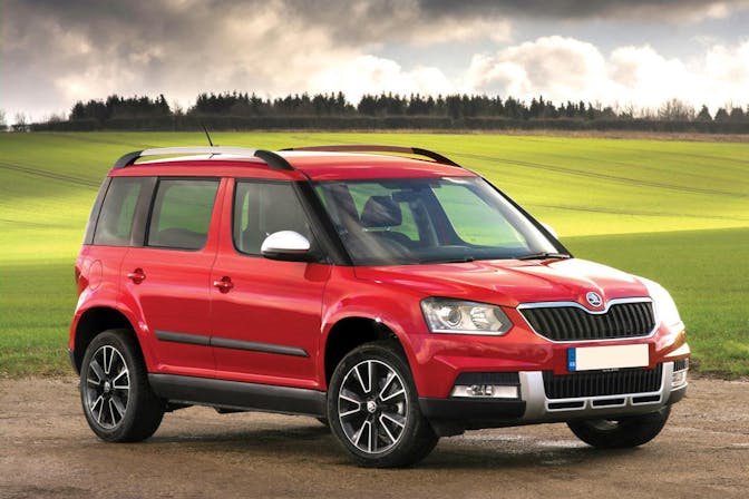 The front exterior of a red Skoda Yeti
