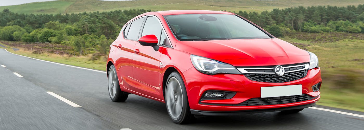 The exterior of a red Vauxhall Astra