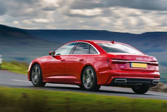 The rear exterior of a red Audi A6