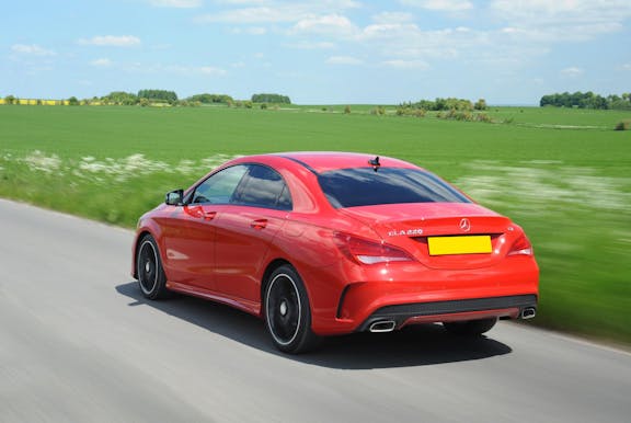 The rear exterior of a red Mercedes-Benz CLA
