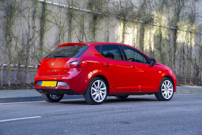 The exterior of a red Seat Ibiza