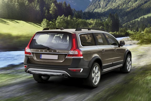 The rear exterior of a gold Volvo XC70