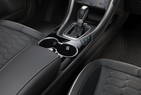 The interior of a Ford Mondeo with steering wheel and dashboard in shot