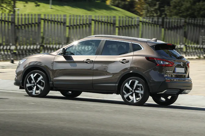 The side exterior of a brown Nissan Qashqai