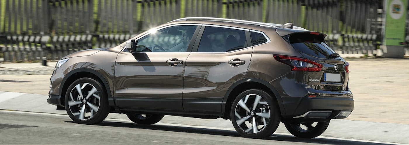 The side exterior of a brown Nissan Qashqai