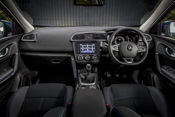 The interior of a Renault Kadjar with steering wheel and dashboard in shot