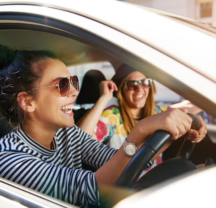 A woman driving her new car