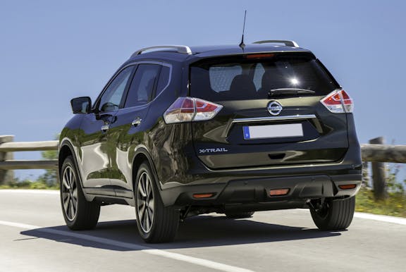 The rear exterior of a black Nissan X-Trail