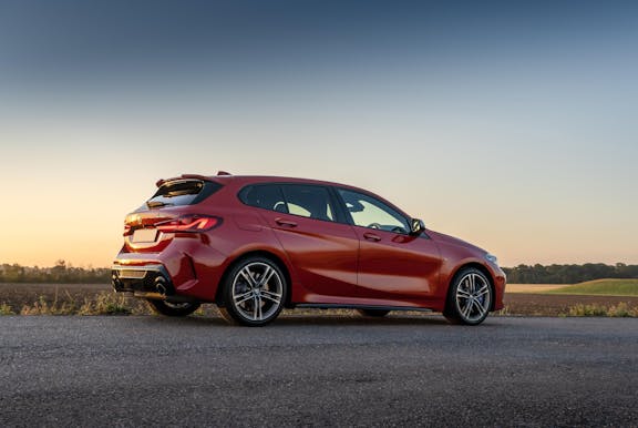 The side exterior of a red BMW 1 series