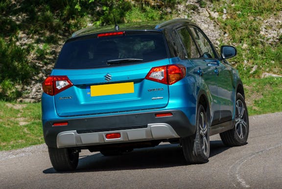 The rear exterior of a blue Suzuki Vitara