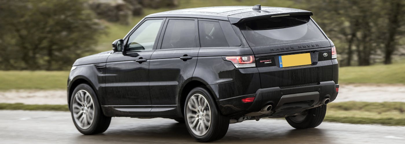 The rear exterior of a black Range Rover Sport