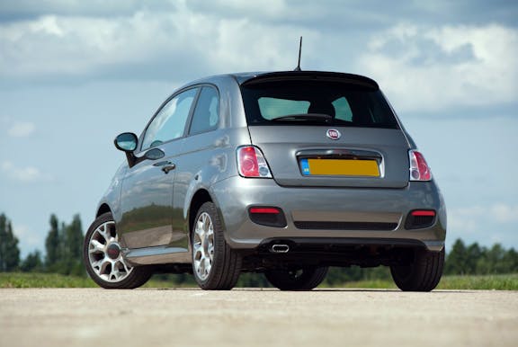 The rear exterior of a silver Fiat 500