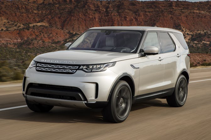 The front exterior of a silver Land Rover Discovery