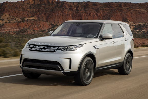 The front exterior of a silver Land Rover Discovery